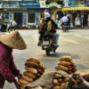 Two-old-ladies-selling-breads-on-the-street-of-Hanoi-Vietnam