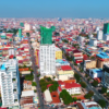 videoblocks-aerial-phnom-penh-cambodia-crowded-streets-city-urban-capitol-buddhism-temp_sadmzgglm_thumbnail-full01