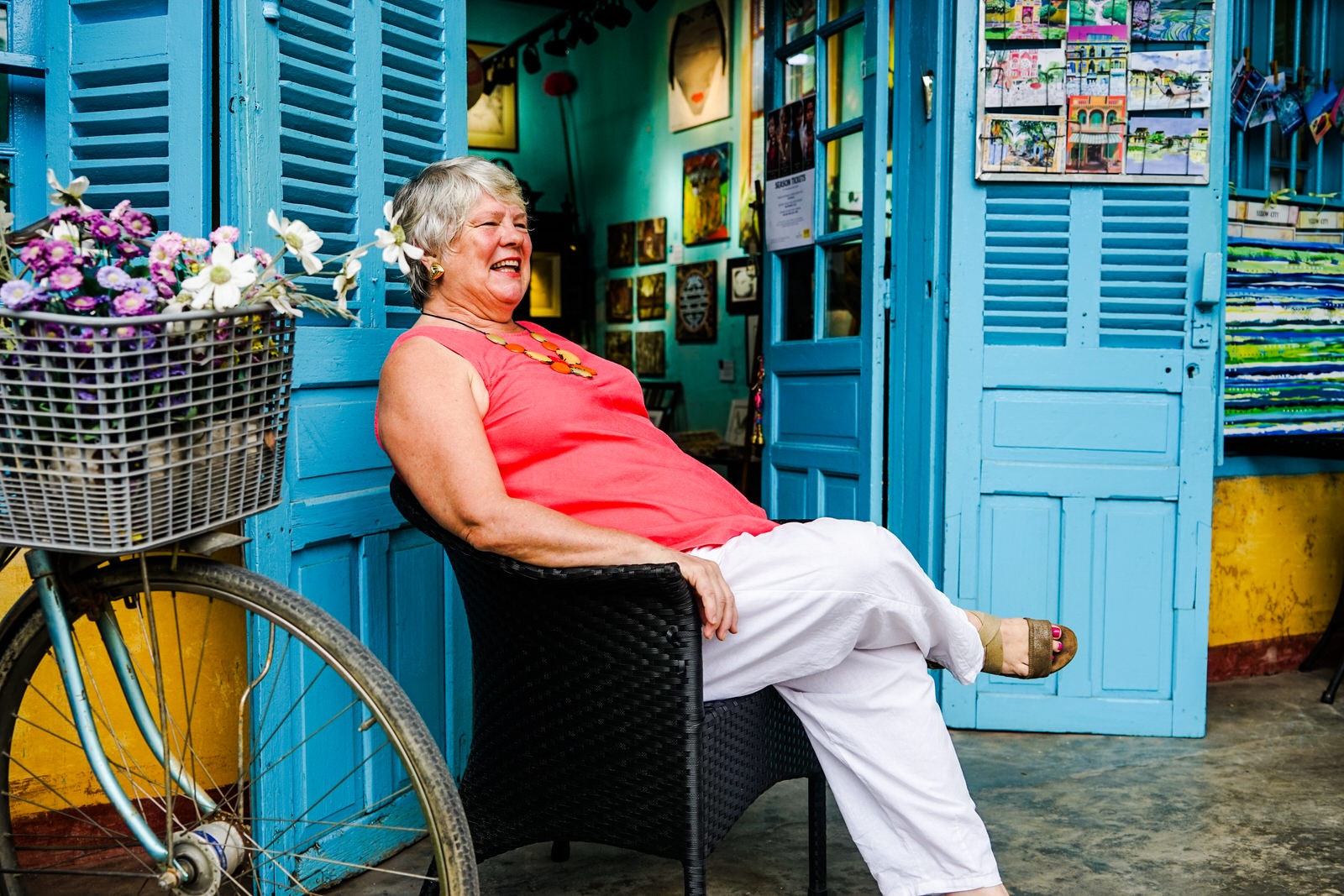 Artist and communicator Bridget March relaxes outside her Hoi An shop