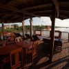 aft_deck_of_a_bassac_in_the_morning_on_a_mekong_delta_canal