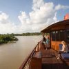lounging_on_the_upper_deck_as_the_bassac_cruises_mang_thit_river